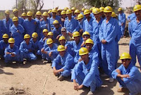 Capt. Josh Aldred (center) poses April 2 with the first Village of Hope class. Aldred and a team of 30 Airmen taught Hawr Rajab residents the basics of construction. Aldred ended his tour in Iraq April 3, 2008. The first class of Village of Hope students will graduate in late May or early June. Courtesy photo.