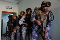 Iraqi police practice clearing a room on Nov. 1. Iraqi security forces are growing in combat strength and logistic capability, resulting in the lowest number of enemy attacks since January 2004.