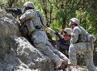 Capt. John Williams (left), Commander of Headquarters and Headquarters Troop, 1st Squadron, 91st Cavalry Regiment (Airborne), observes the hill top while Staff Sgt. William Randall (center),directs Sgt. Shawn Seymour (right), a M-240B machine gun operator, during Operation Mountain Highway II April 27 in Nuristan Province Afghanistan. American, Afghan and Packistani troops are sqeezing terror groups in the border region. (U.S. Army Photo/Staff Sgt. Brandon Aird)