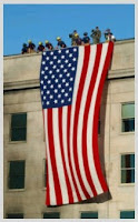 Men who hung our flag over the top of a building in defience of the cowardly attacks.