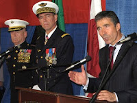 NATO Secretary General Anders Fogh Rasmussen, right, speaks with reporters as Marine Corps Gen. James N. Mattis, commander of U.S. Joint Forces Command, far left, and Gen. Stephane Abrial of the French air force, incoming commander of NATO’s Allied Command Transformation, look on at Naval Station Norfolk, Va.