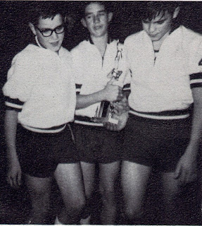 Gene Meyer, Bill Schwich and Steve Roettjer pictured as members of the basketball team accepting the second-place trophy at a basketball tournament in Bee, Nebraska. The photo is taken from the 1965-1966 yearbook of St John Elementary School in Seward, Nebraska