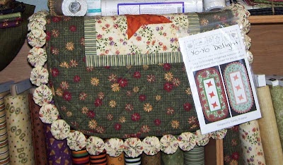 Yo-Yo Delight Table Runner Pattern by Sandy Brawner sample displayed at J&R Sewing in Fargo, ND