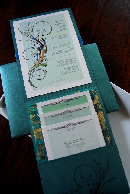 This is a beautiful peacockthemed wedding invitation that's vintagestyled 