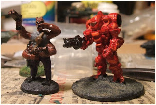 L to R: Peter Pig Large Green Martian (Traveller Sydite), Cyclops battle suit by Ground Zero Games