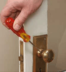 A setscrew on a doorknob locks the knob to the spindle A setscrew on a doorknob locks the knob to the spindle