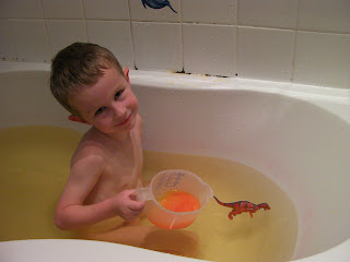 orange bath fizzer in plastic kitchen measuring jug for bath play