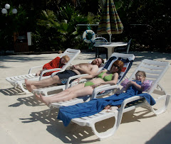 This IS the life!  The French family sunning at the Pool at Banana Bay