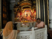 priest and worshiper  in Shiva temple