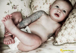 unique tattoo on the baby's arms