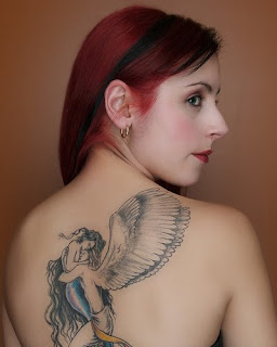 Angel tattoo design on the back of two girls body