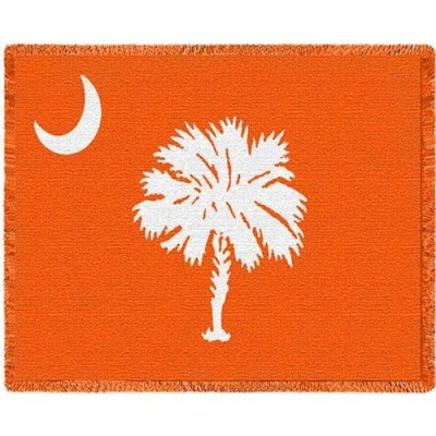 Clemson University blanket that is South Carolina state flag colored orange.