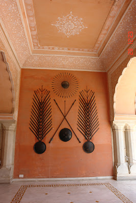 A lot of weapons mounted on the wall inside the Jaipur City Palace