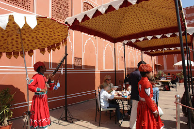 Photo of the Cafe of the Jaipur City Palace with waiters and tourists