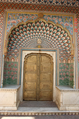 Slightly askew photo of a decorated door inside the Jaipur City Palace