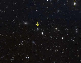 A gravitational lens and its surroundings