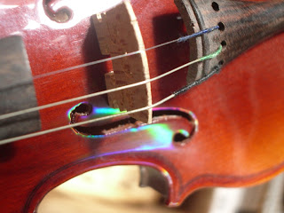 violin bridge rainbow light prism natacha colmez