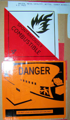 Raney Nickel: Spontaneously Combustible! Danger: Do not load in passenger aircraft!