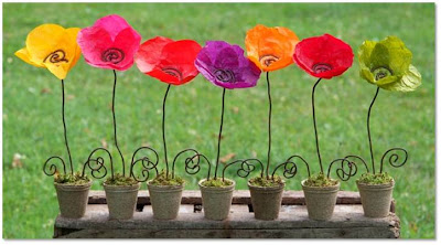 paper flowers in a handmade wire vase