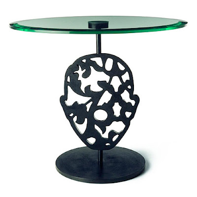 The Naval Brass Glass Top table was designed by Marcel Wanders for Moooi in 
