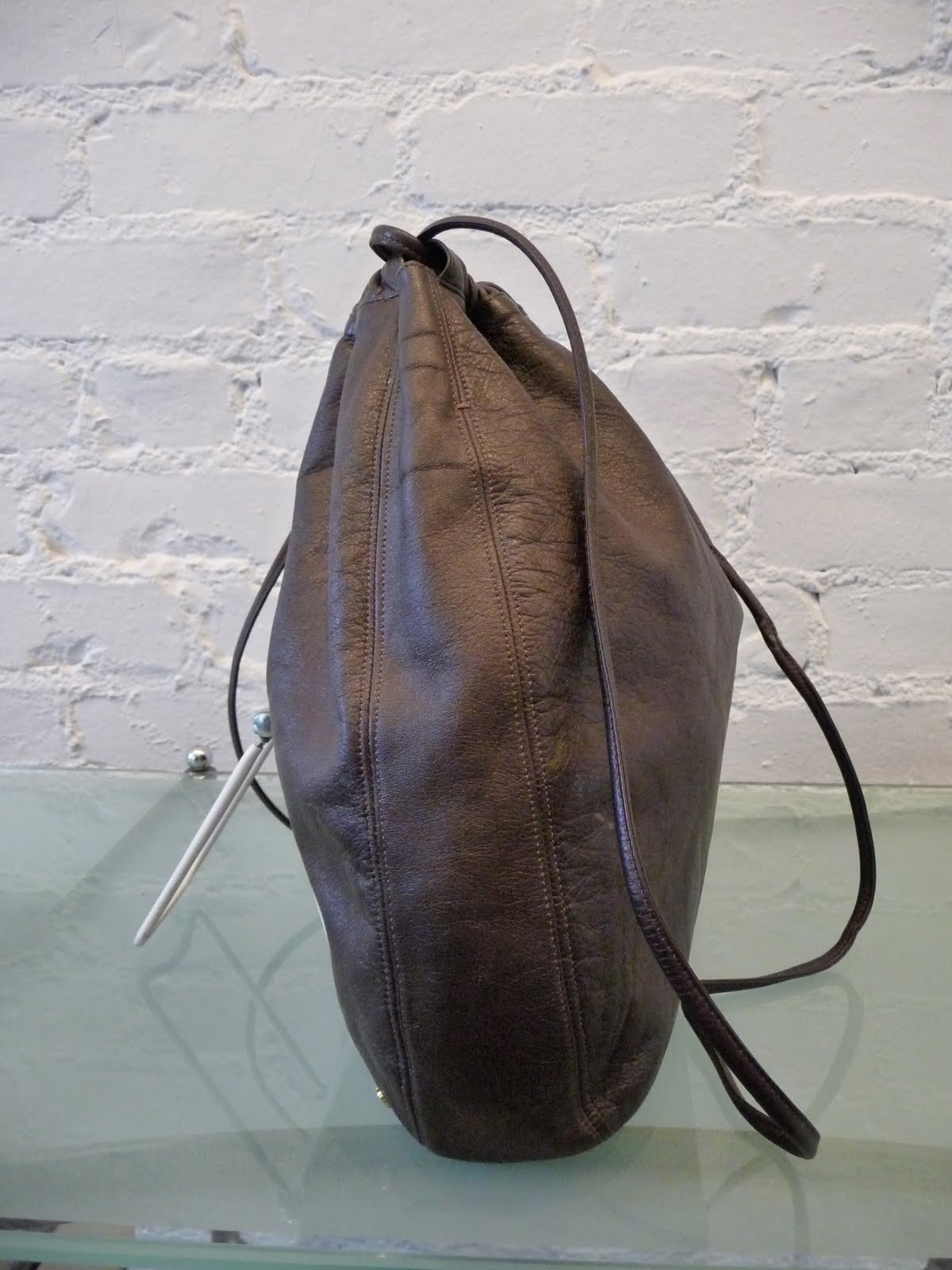 DECADES INC. "Over the shoulder boulder holder"