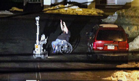 [WheelchairGunmanSurrendersToPoliceRobot]