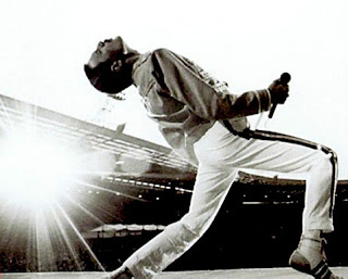 Image of Freddy Mercury playing air-guitar - well sort of.