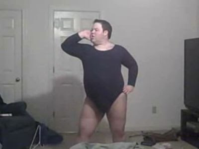 fat guy on computer. This fat guy in black swimsuit