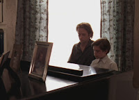 Ned and Joshua playing piano.