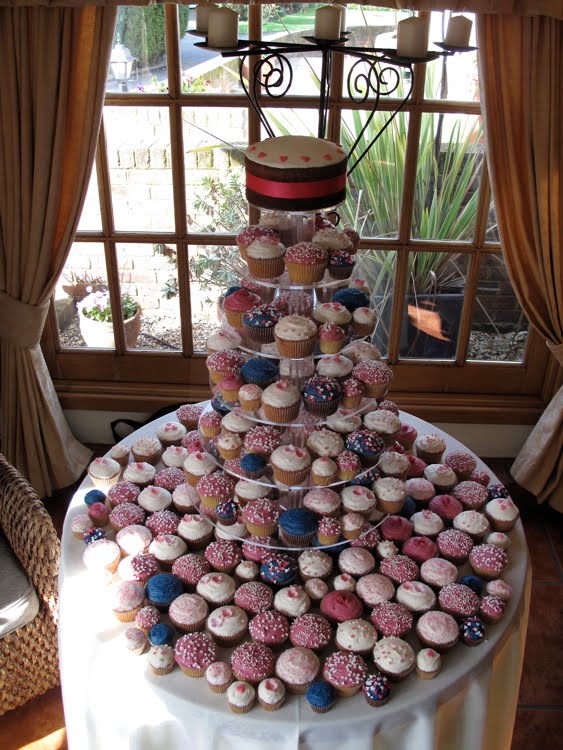 Hot pink and Navy cupcakes Here 39s a wedding tower we did for Anne in a hot Hot pink and Navy cupcakes Here 39s a wedding tower we did for Anne in a hot