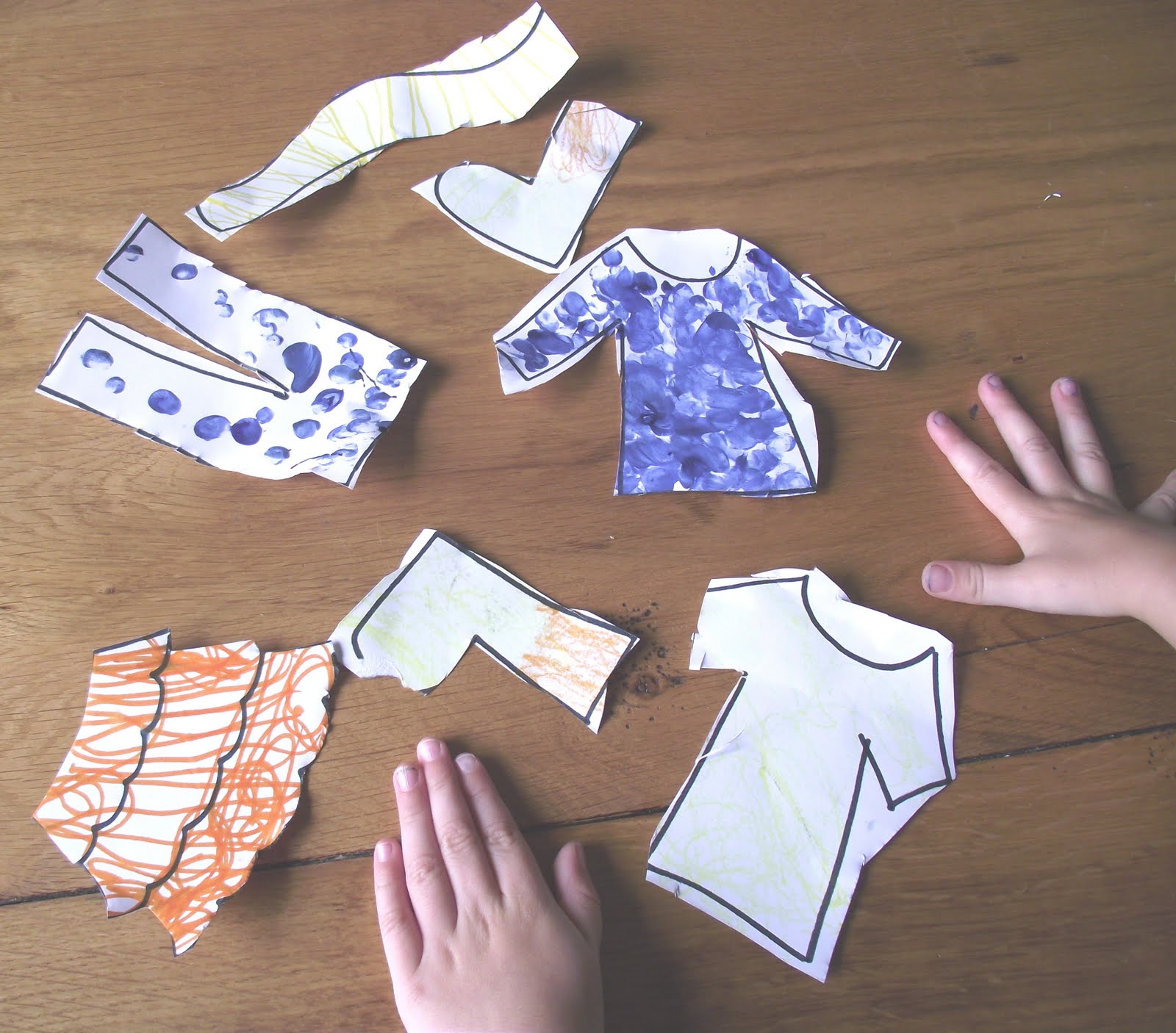 Two Little Seeds Making Paper Clothes for a Washing Line