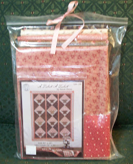 kit of fabrics and pattern for making a basket wallhainging in pinks and browns