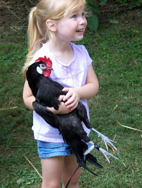 Emma Cole holding the rooster