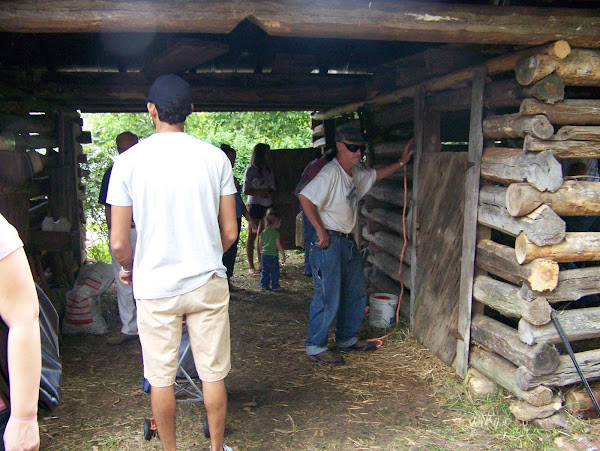Visitors enjoy seeing the stalls of the old log barn