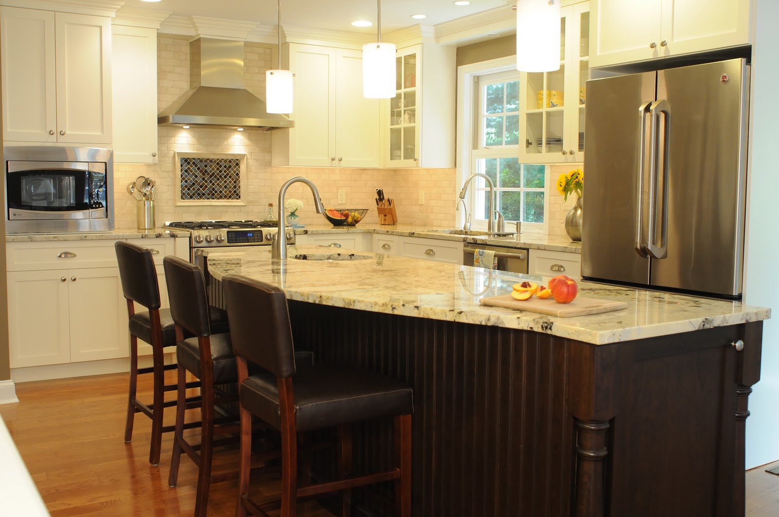 the kitchen The range hood is now the focal point of the back wall the kitchen The range hood is now the focal point of the back wall