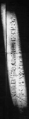 shafts of light illuminate the glyphs