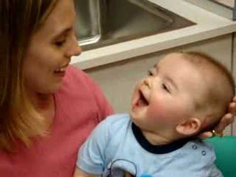 Cute Baby boy laughing with mother photo
