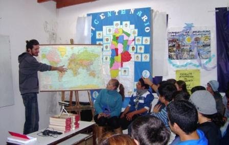 Acrobat of the Road showing students a map