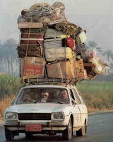 a car with a large pile of boxes on top