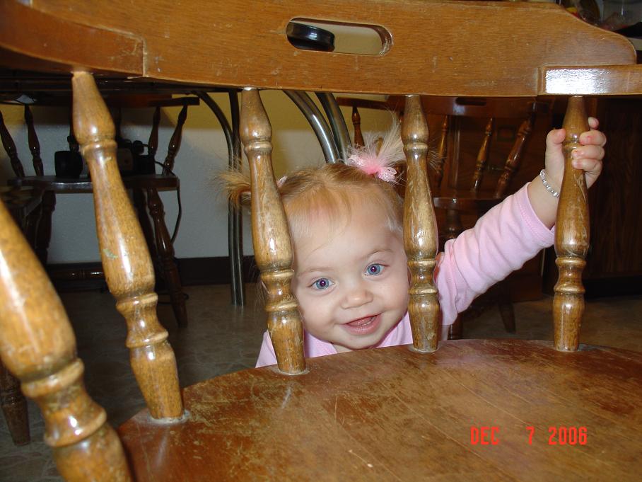 [CharlotteSmilingThroughChairRails.JPG]