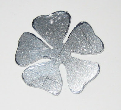 flower cut from aluminium by surf jewels handmade jewellery