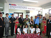Asiana Airlines president Joo-An Kang, Saipan Asiana Airlines general manager Kwang Joong Kim, Asiana executive Choong-Sik Kwak, Lt. Gov. Timothy P. Villagomez, Marianas Visitors Authority chairman Jerry Tan, and other dignitaries pose for a photo at the airport during the inaugural flight ceremony of Asiana's first daytime flight to Saipan. 