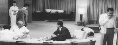 Tatsuya Nakadai (second from right, seated) and Toshirō Mifune in High and Low