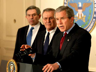 Paul Wolfowitz, Donald Rumsfeld, and George W. Bush - a triumvirate of pure evil