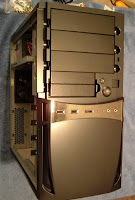 Front of case with top front cover removed, three large bays and two small ones