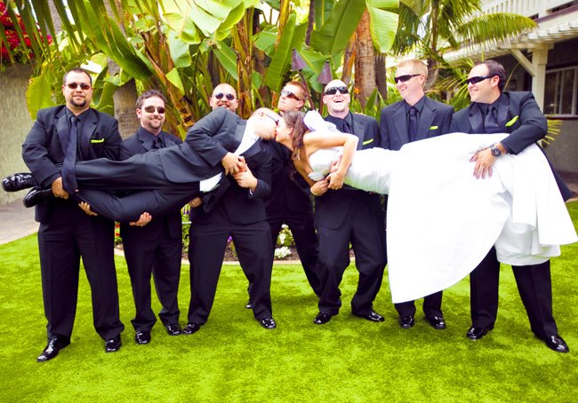 picking up the bride wedding photography bridal party kissing by clane gessel. Creative wedding photographer