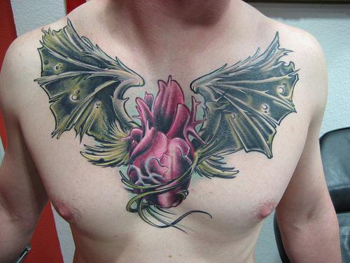 wing tattoos on chest for men. Chest tattoos for men and women can definitely create a bold statement
