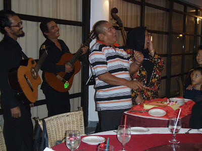The birthday boy Pak Hasan enjoying a light moment with wife and friends