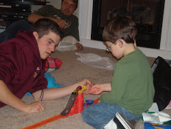 Joseph playing cars with Andrew