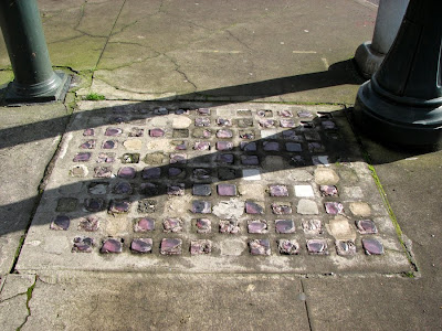 Purple glass squares in the sidewalk